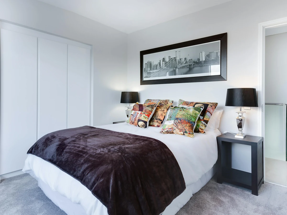 Interior painting in Lincoln - modern white bedroom by Lincoln Decorators