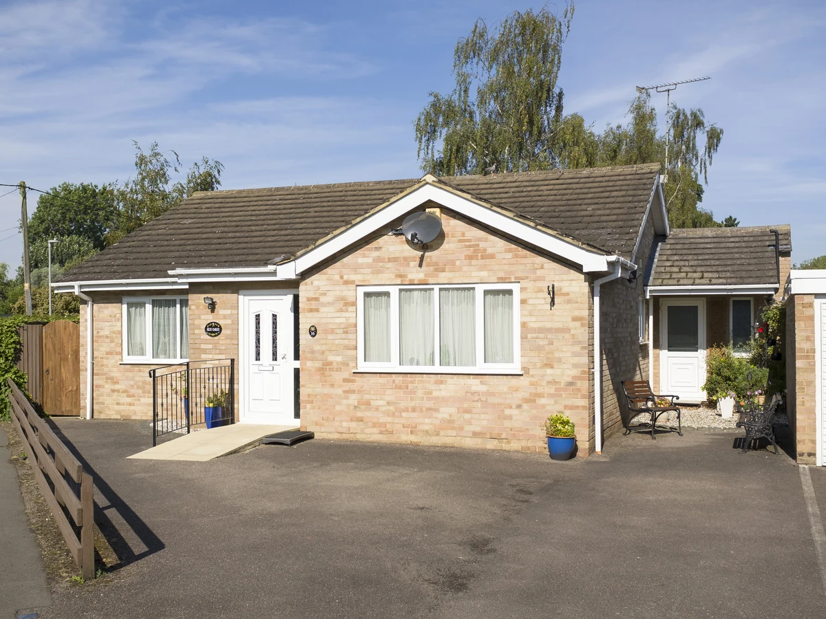Brick bungalow exterior showing typical masonry painting costs in Lincoln