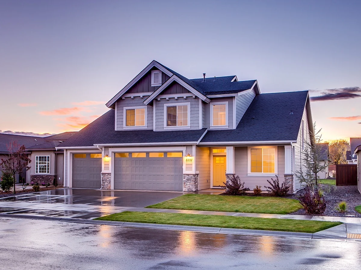 Large suburban house exterior painting in Lincoln by Lincoln Decorators