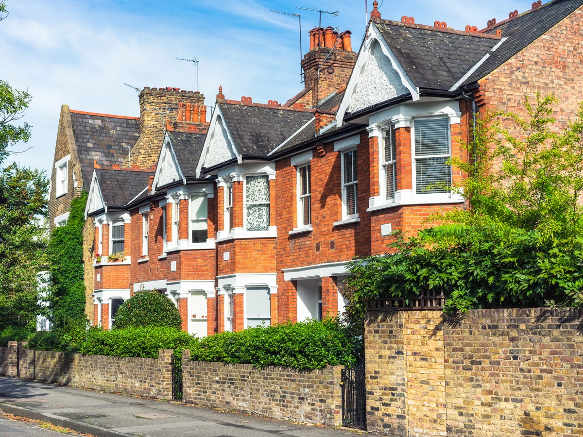 Traditional red brick house exterior painting in Lincoln by Lincoln Decorators