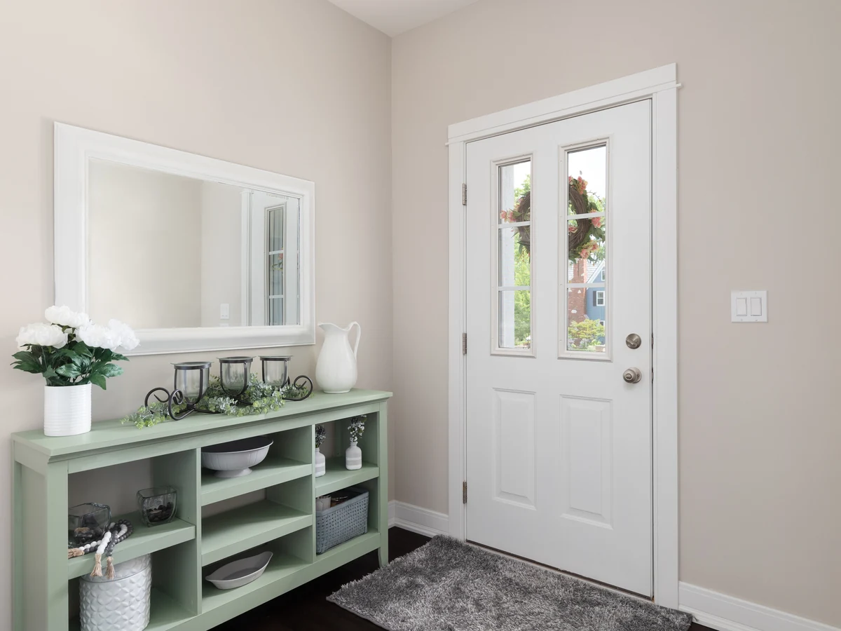 Hallway wallpapering in Bardney, entryway with beige walls by Lincoln Decorators
