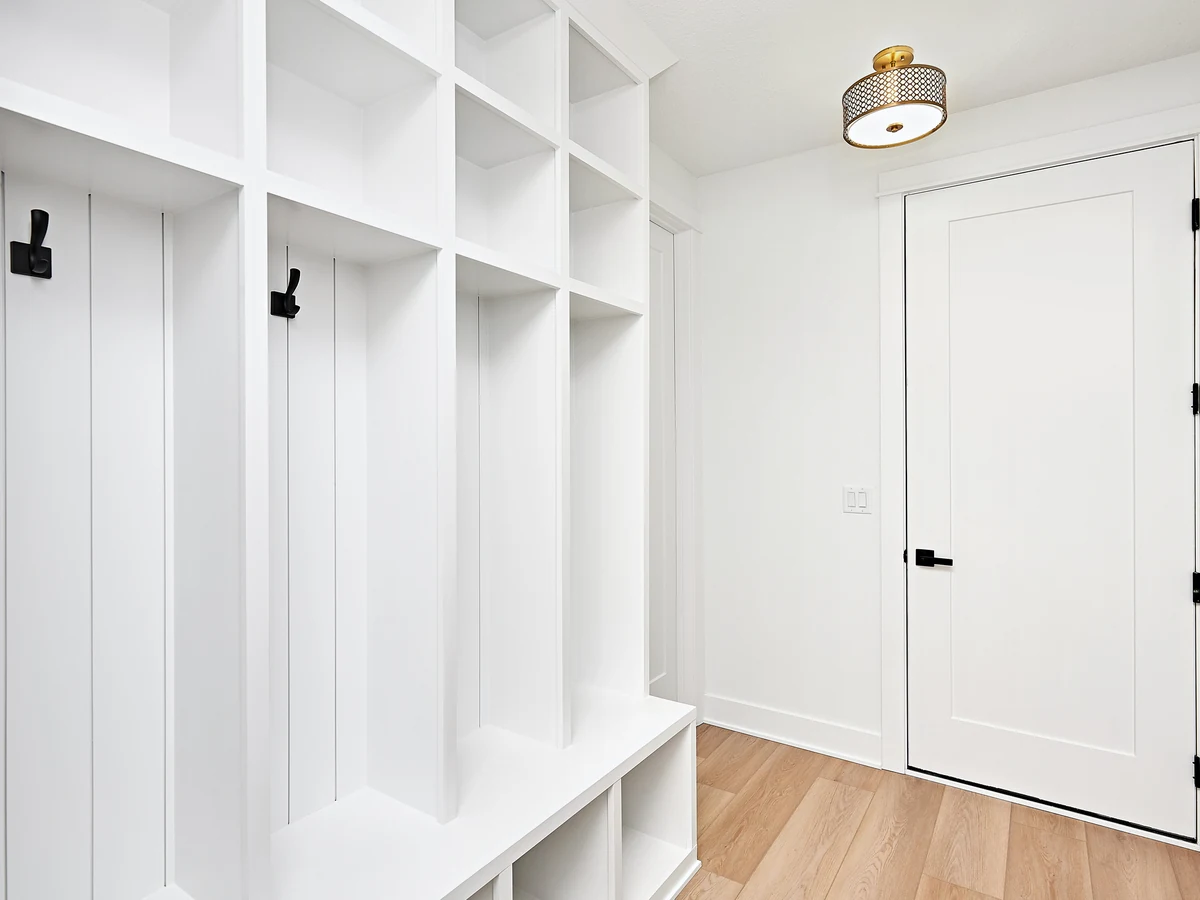 Hallway painting in Lincoln by Lincoln Decorators, white mudroom coat entrance hallway