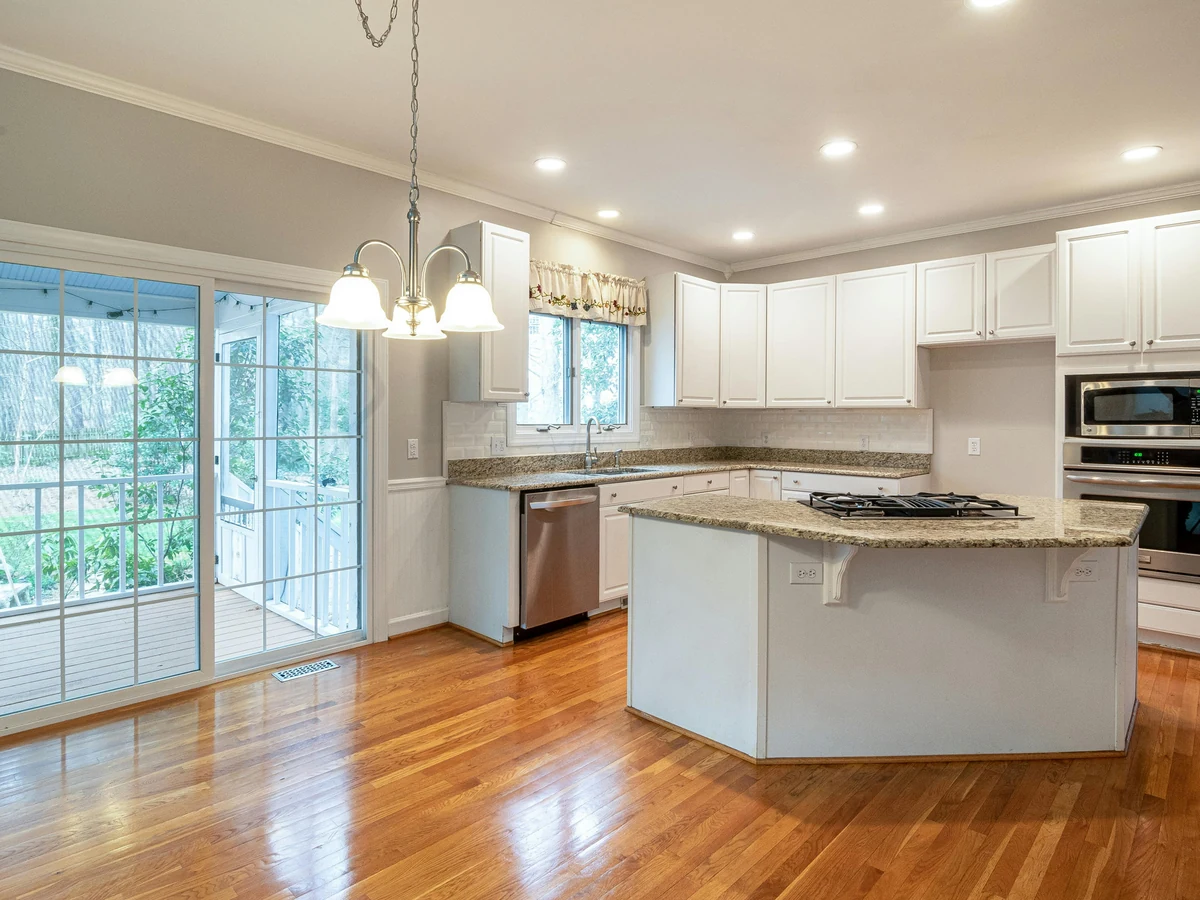 kitchen-painting-white-kitchen-island-lincoln-decorators Kitchen cabinet painting in Lincoln by Lincoln Decorators, white kitchen island with professional finish