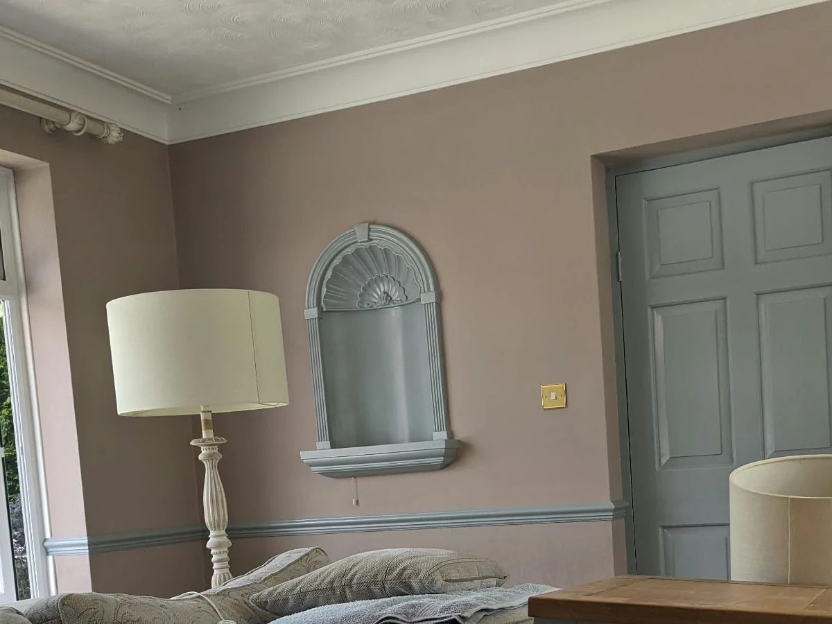 living-room-painting-grey-trim-finish-lincoln-decorators Finished living room with warm painted walls and grey trim in Lincoln by Lincoln Decorators