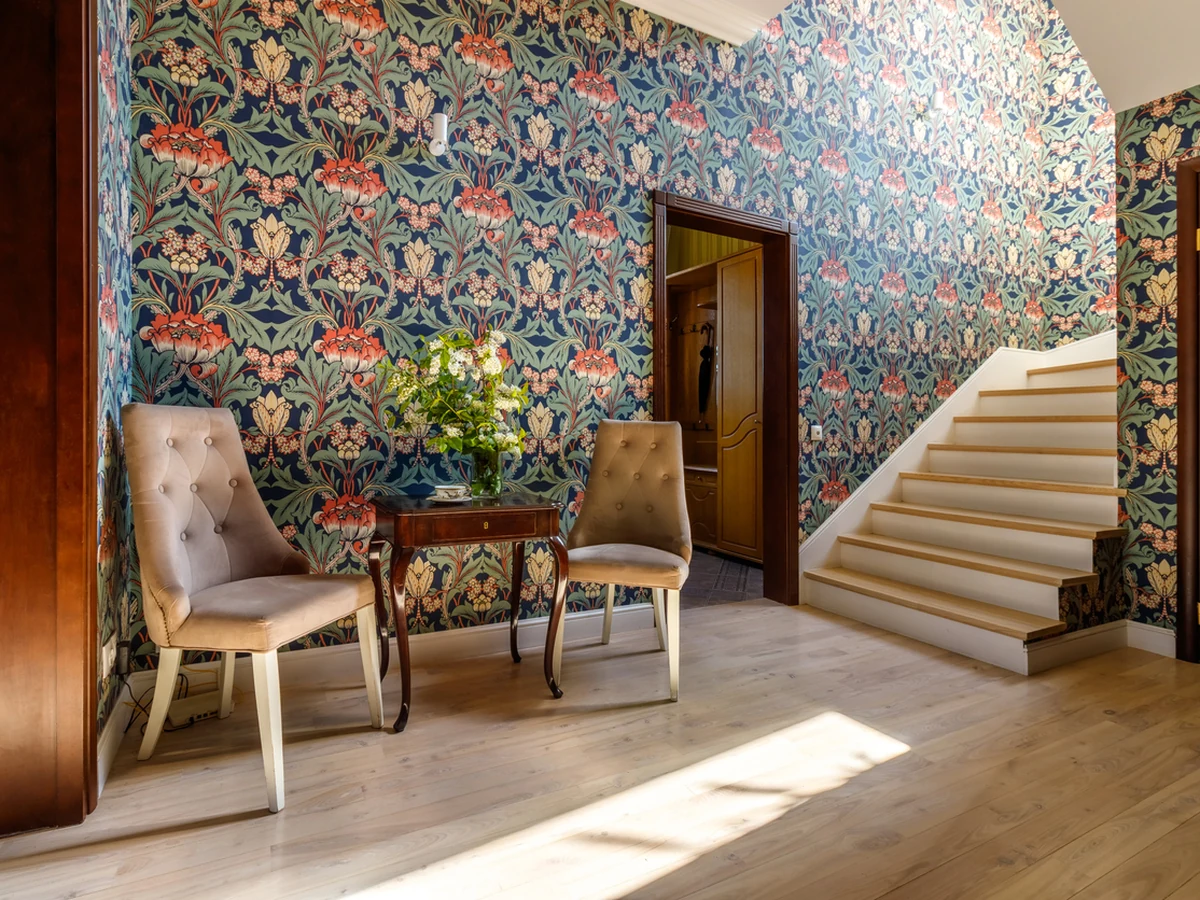 Wallpapering with ornate floral wallpaper in Lincoln by Lincoln Decorators, professional wallpaper hanging