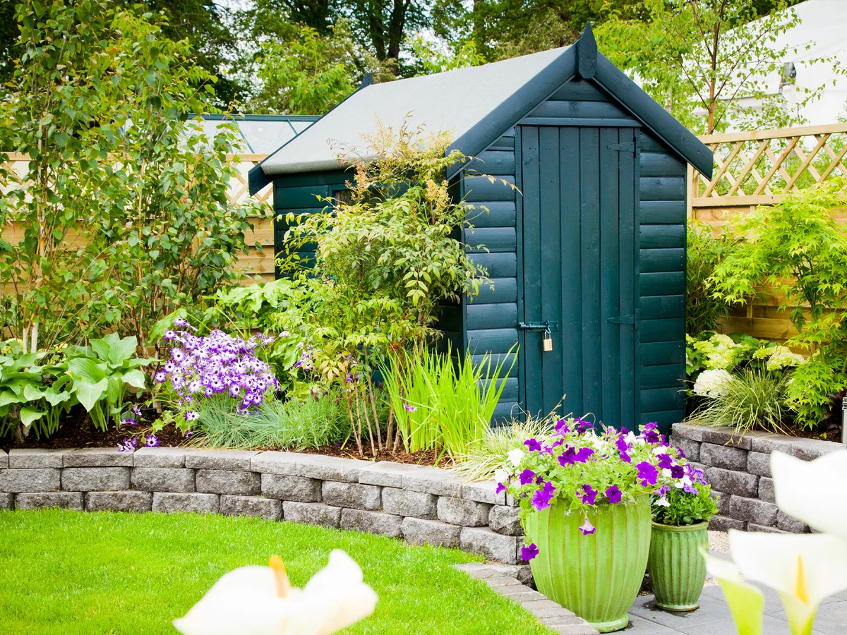 Dark teal painted wood garden structure in Lincoln by Lincoln Decorators